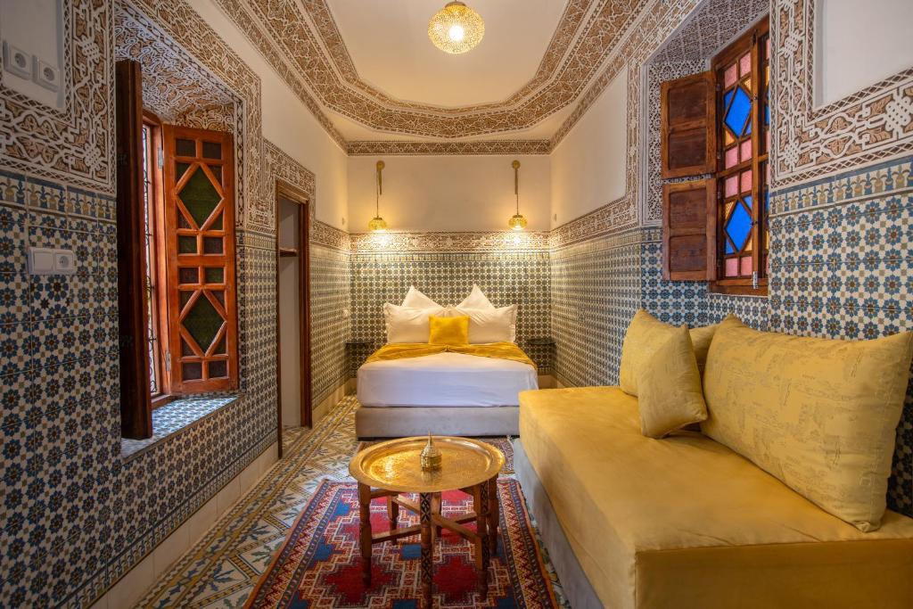 Postel nebo postele na pokoji v ubytování Riad Albaraka