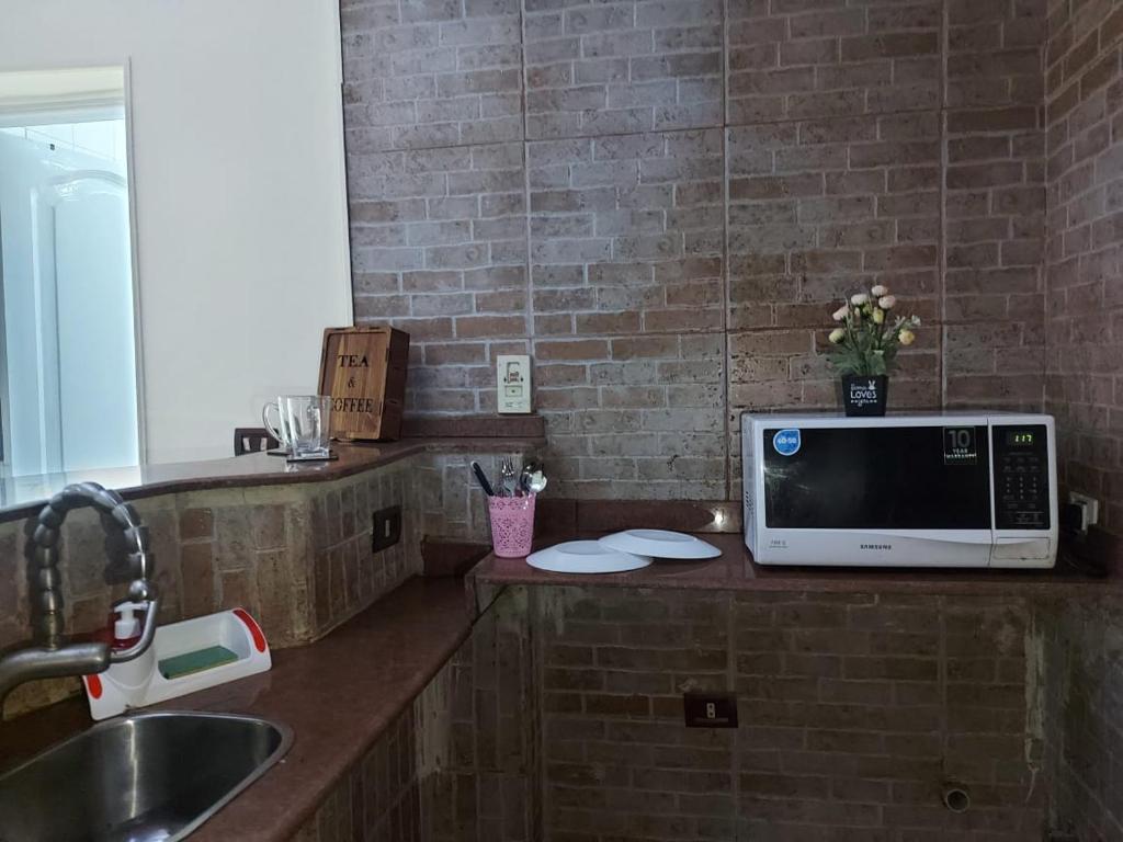 Kuchyň nebo kuchyňský kout v ubytování Malak Guest House
