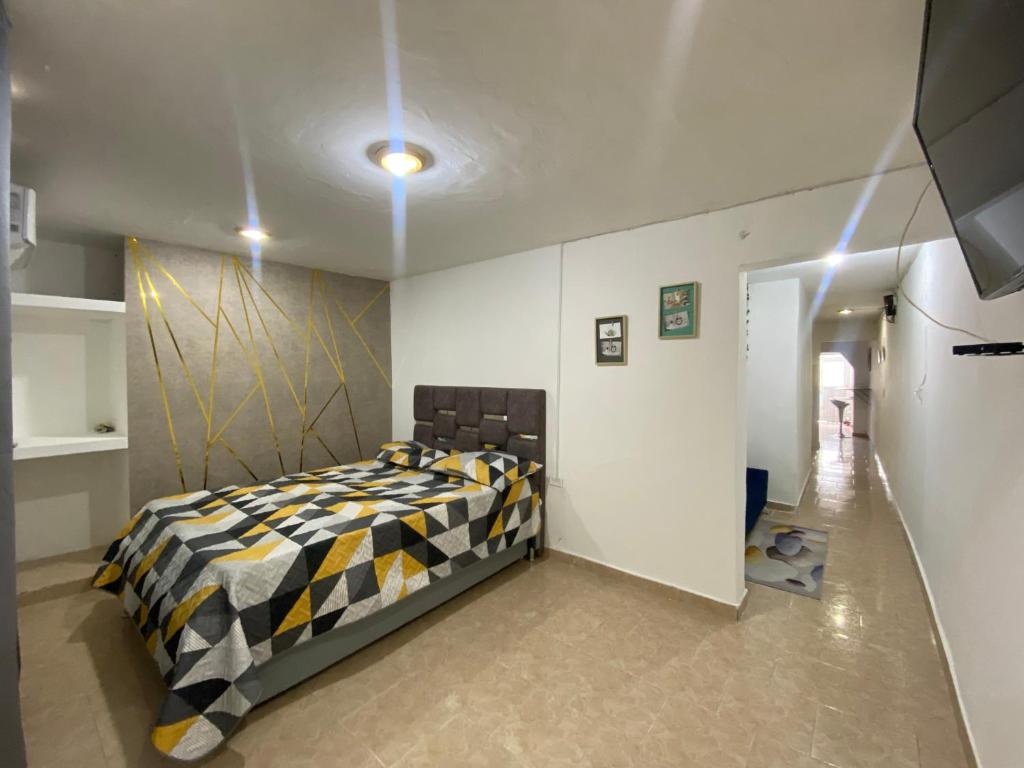 Llit o llits en una habitació de Apartaestudio LONG Vipasa