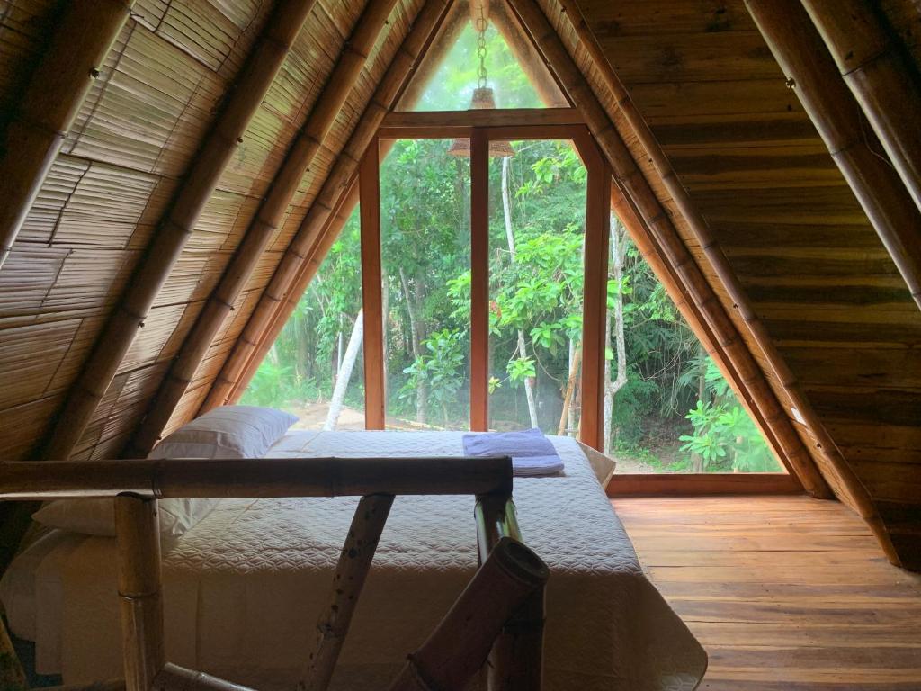 Llit o llits en una habitació de Tiny Houses Unique Tayrona - Dentro del Parque Tayrona