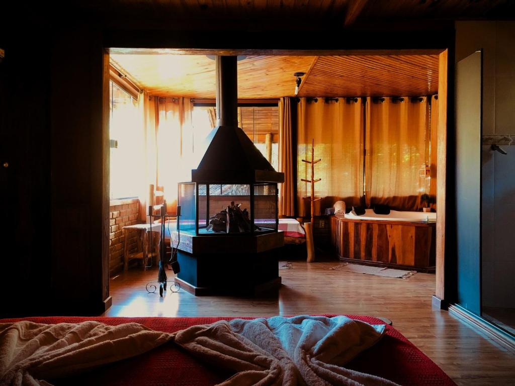 Postel nebo postele na pokoji v ubytování Pousada chalés Binitz