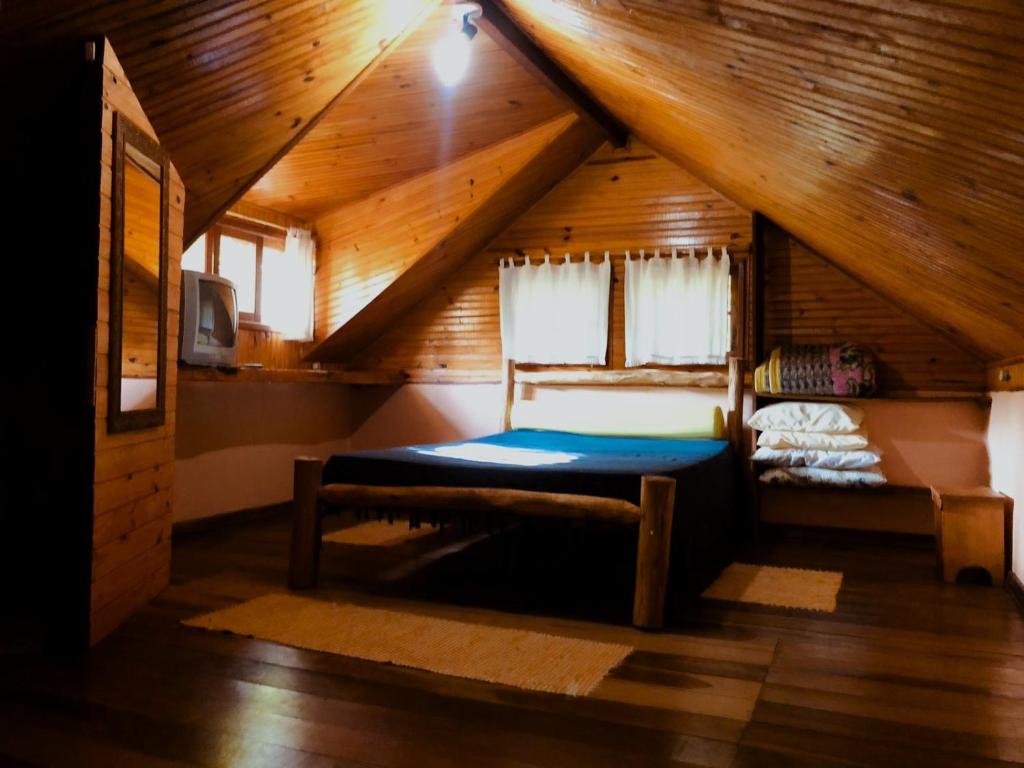 Postel nebo postele na pokoji v ubytování Pousada chalés Binitz