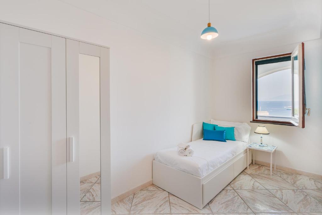 Postel nebo postele na pokoji v ubytování Emozioni Capresi Guest House