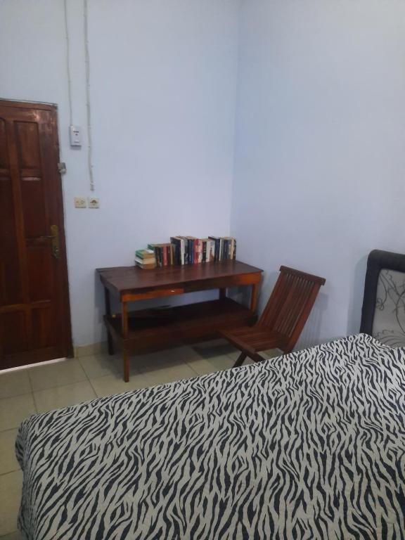Postel nebo postele na pokoji v ubytování Red Beach Homestay