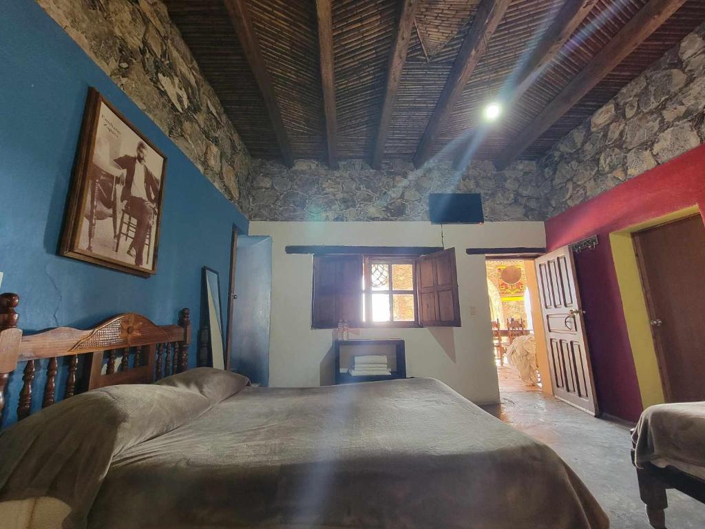 Postel nebo postele na pokoji v ubytování HOTEL RINCÓN MAGICO REAL DE CATORCE