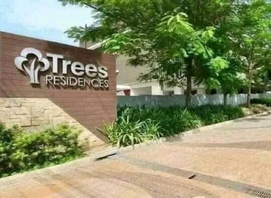 a tree reserves sign in front of a building at Trees Residences 2 Bedroom Unit T19 by HerGura PMS in Manila