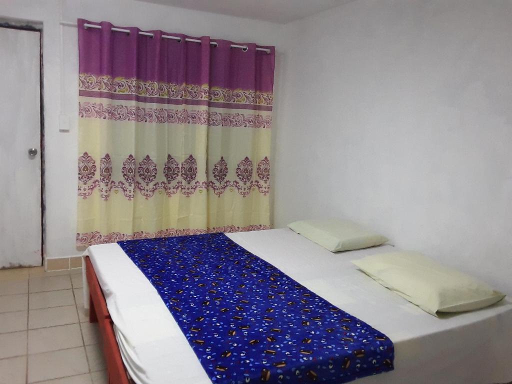 Postel nebo postele na pokoji v ubytování Kathy B Guesthouse