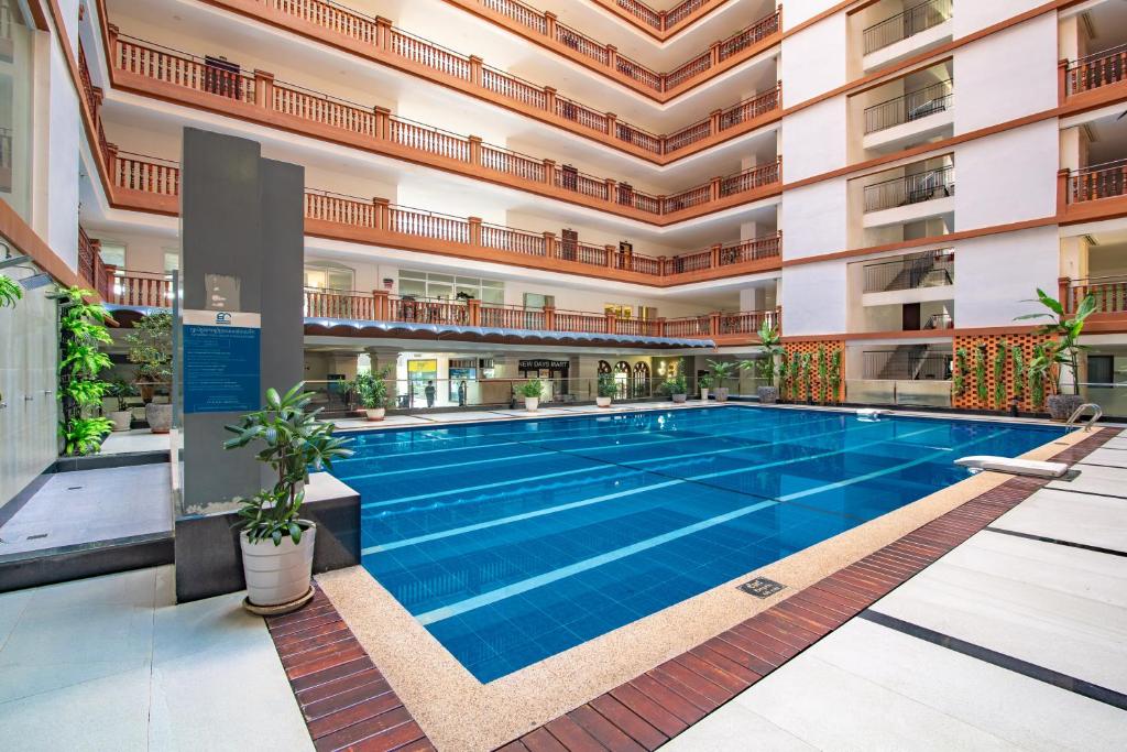 a swimming pool in the middle of a building at MekongView 2 CondoTel in Phnom Penh