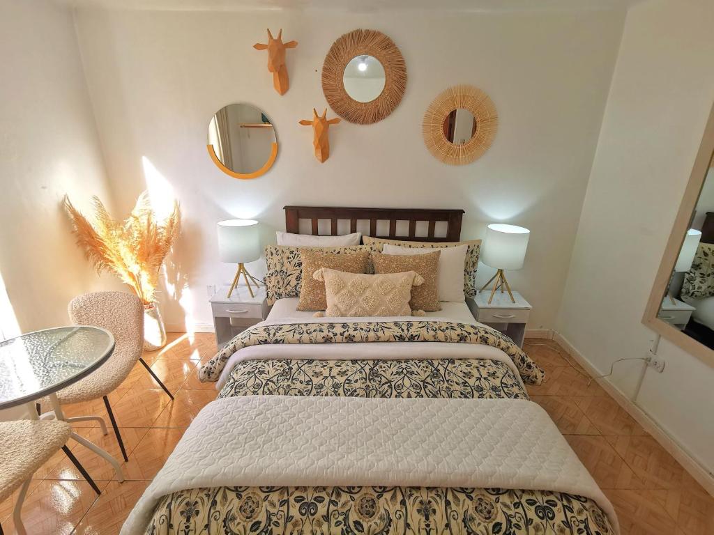 Postel nebo postele na pokoji v ubytování Cusco Kintu House