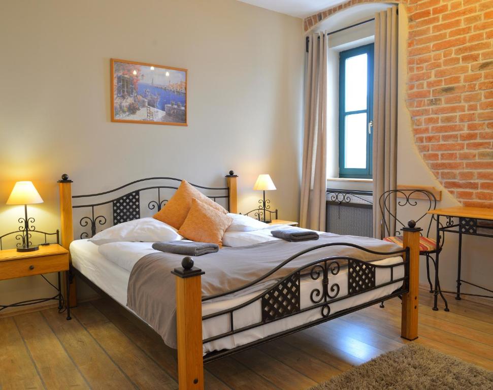 Postel nebo postele na pokoji v ubytování Hotel Via Ironia