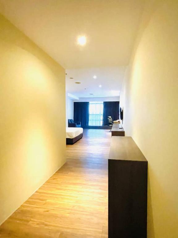 Postel nebo postele na pokoji v ubytování Imperial Regency Suites & Kuala Lumpur