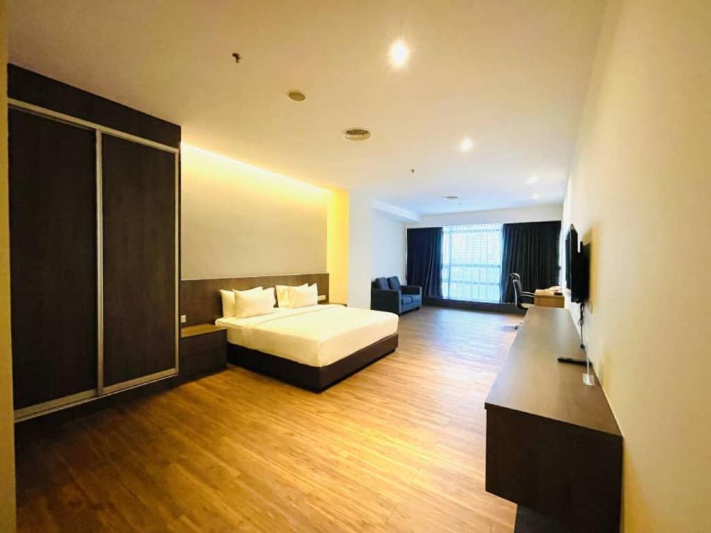 Postel nebo postele na pokoji v ubytování Imperial Regency Suites & Kuala Lumpur