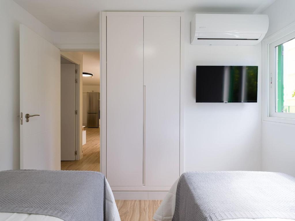 Televízia a/alebo spoločenská miestnosť v ubytovaní Olas Suites Playa del Ingles