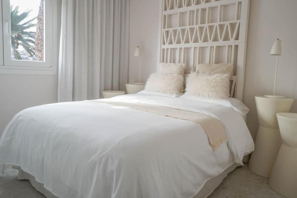 Posteľ alebo postele v izbe v ubytovaní Agustino Beach Suites San Agustin