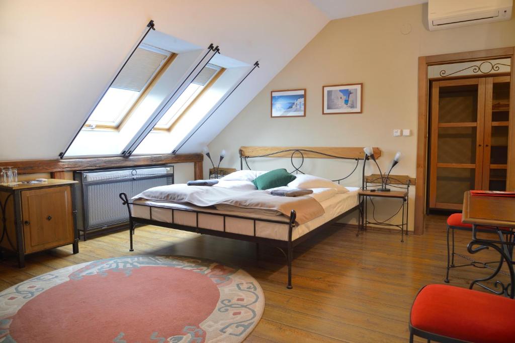 Postel nebo postele na pokoji v ubytování Hotel Via Ironia