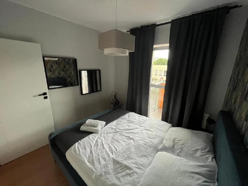 Posteľ alebo postele v izbe v ubytovaní Nice Apartments