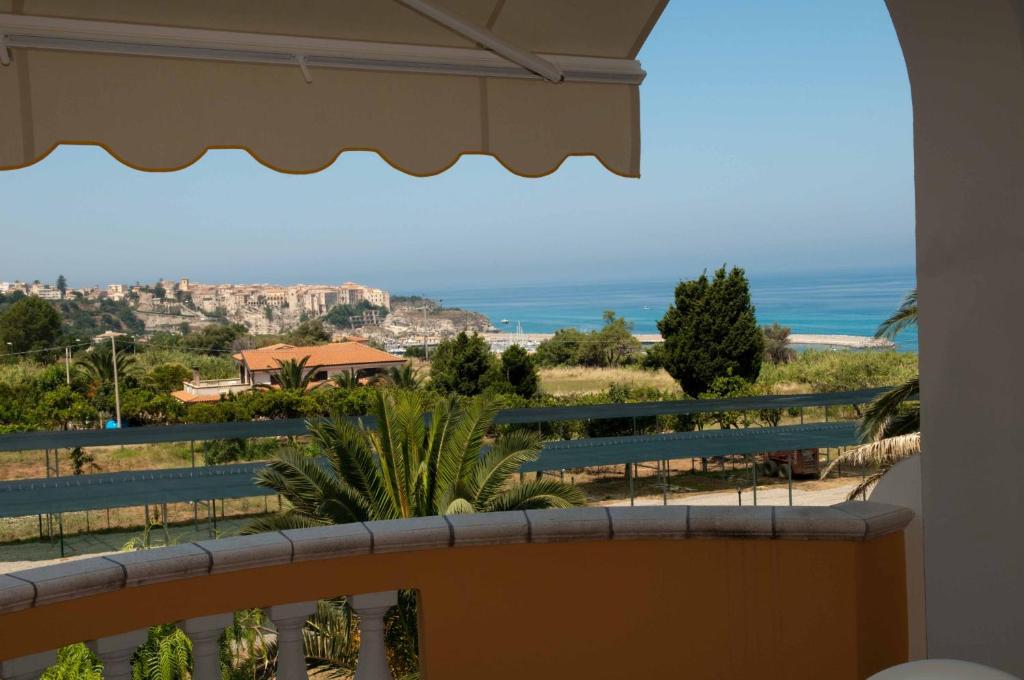 a balcony with a view of the ocean at Residence Porto Ulisse in Parghelia