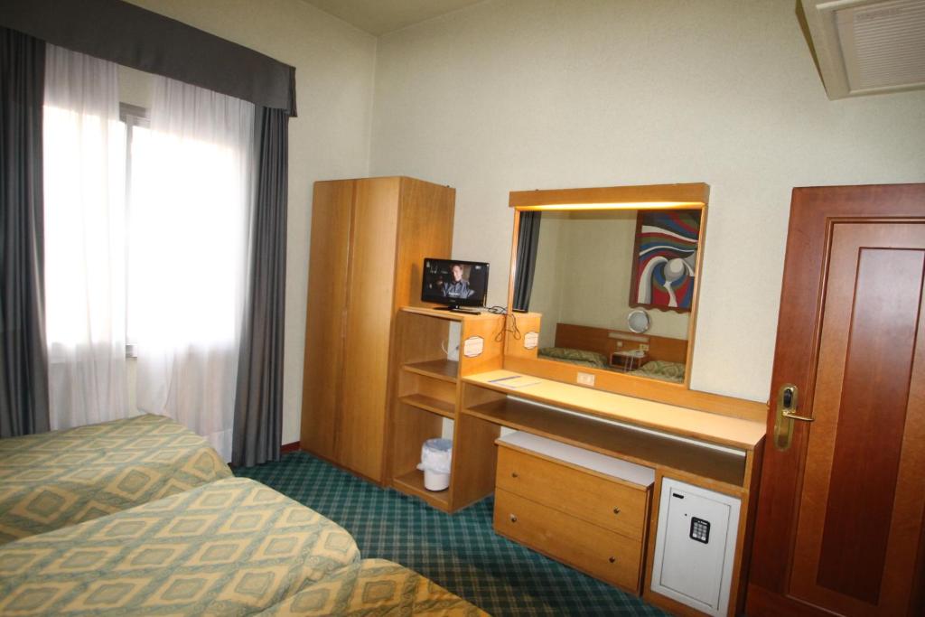 Postel nebo postele na pokoji v ubytování Hotel Europa