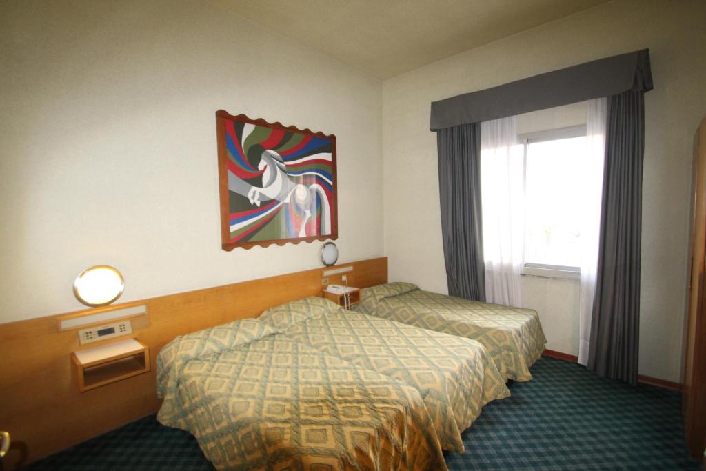 Postel nebo postele na pokoji v ubytování Hotel Europa