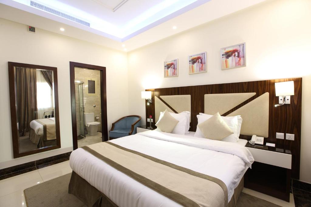 Postel nebo postele na pokoji v ubytování Sun Park Hotel Suites