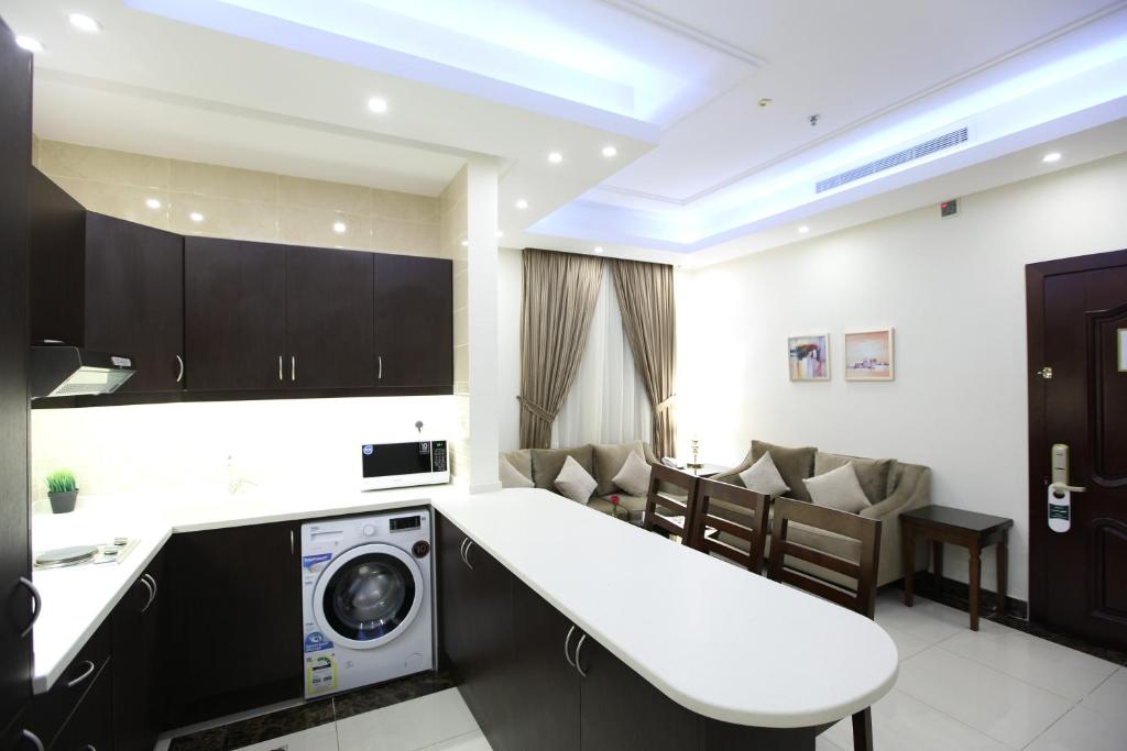 Kuchyň nebo kuchyňský kout v ubytování Sun Park Hotel Suites
