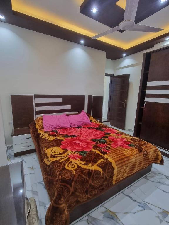 a large bed sitting in a room with at Coral House in Hurghada