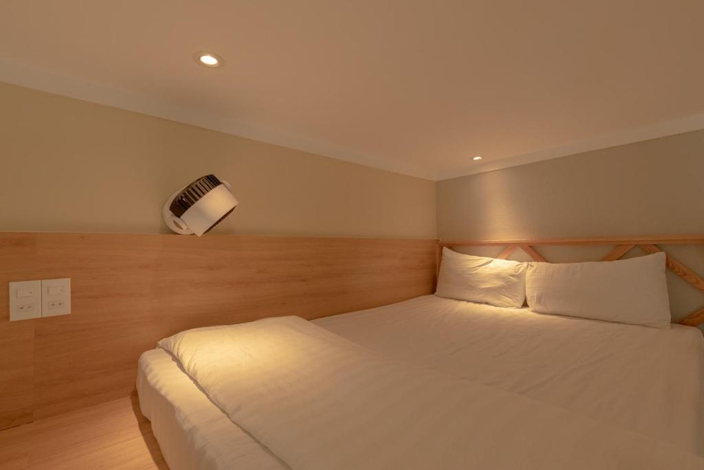 Postel nebo postele na pokoji v ubytování Tây Tiến Bungalow