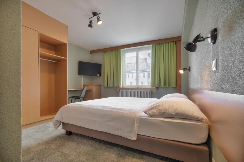 Postel nebo postele na pokoji v ubytování flexymotel Schönenwerd