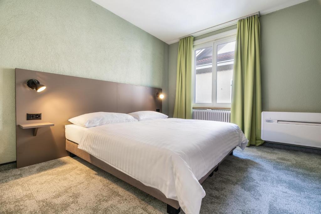 Postel nebo postele na pokoji v ubytování flexymotel Schönenwerd