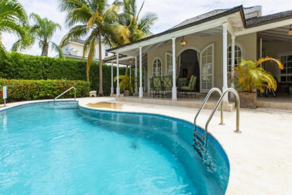 een zwembad voor een huis bij Palm Ridge 2A Heaven Scent, Royal Westmoreland by Barbados Sothebys International Realty in Saint James