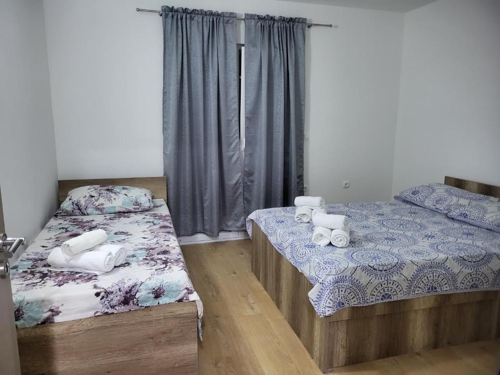 Postel nebo postele na pokoji v ubytování Apartmani Škorpion