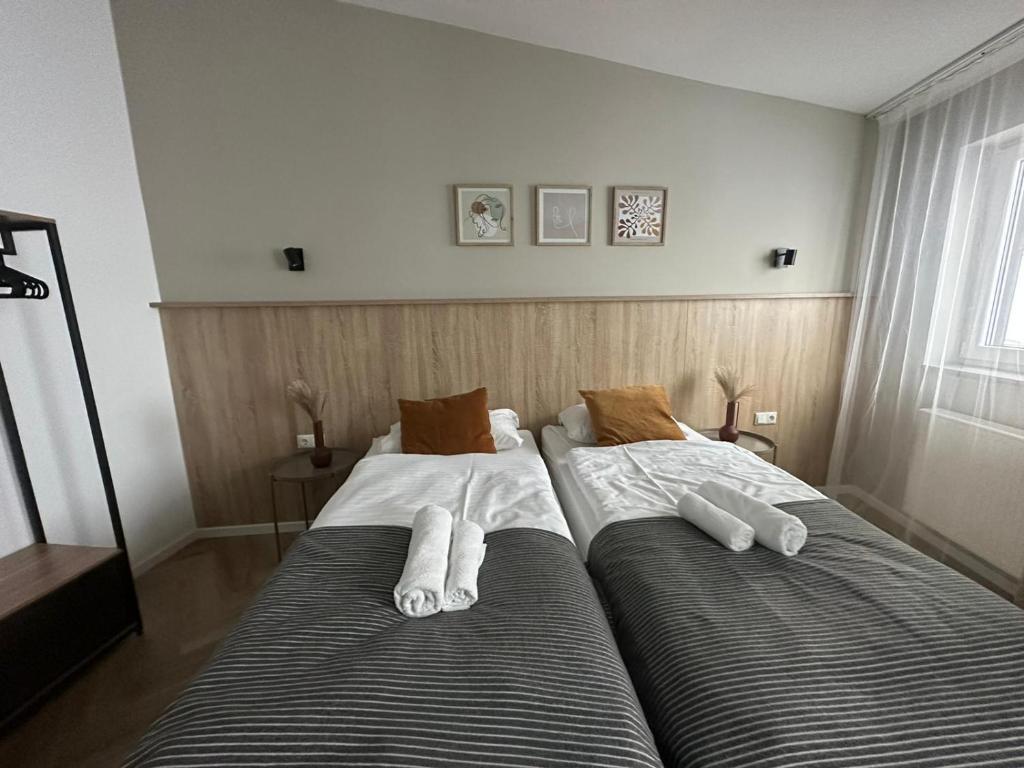 Postel nebo postele na pokoji v ubytování Aparthotel Lenau