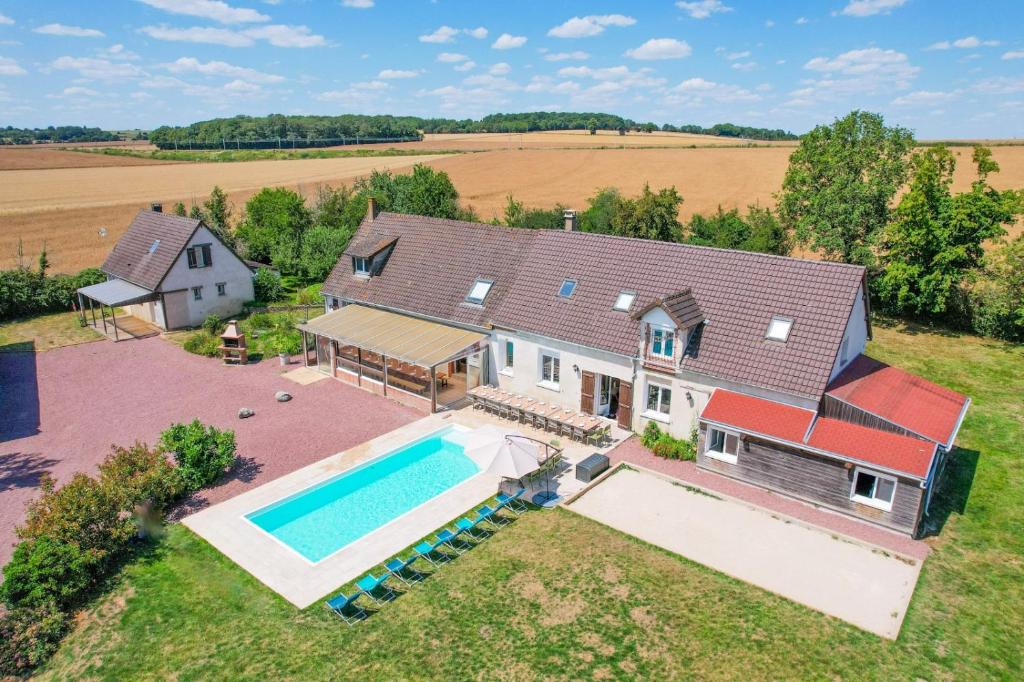 an aerial view of a house with a swimming pool at Crazy Villa Le Tertre 28 - Heated pool - Basket - 2h Paris - 44p in Courtalain