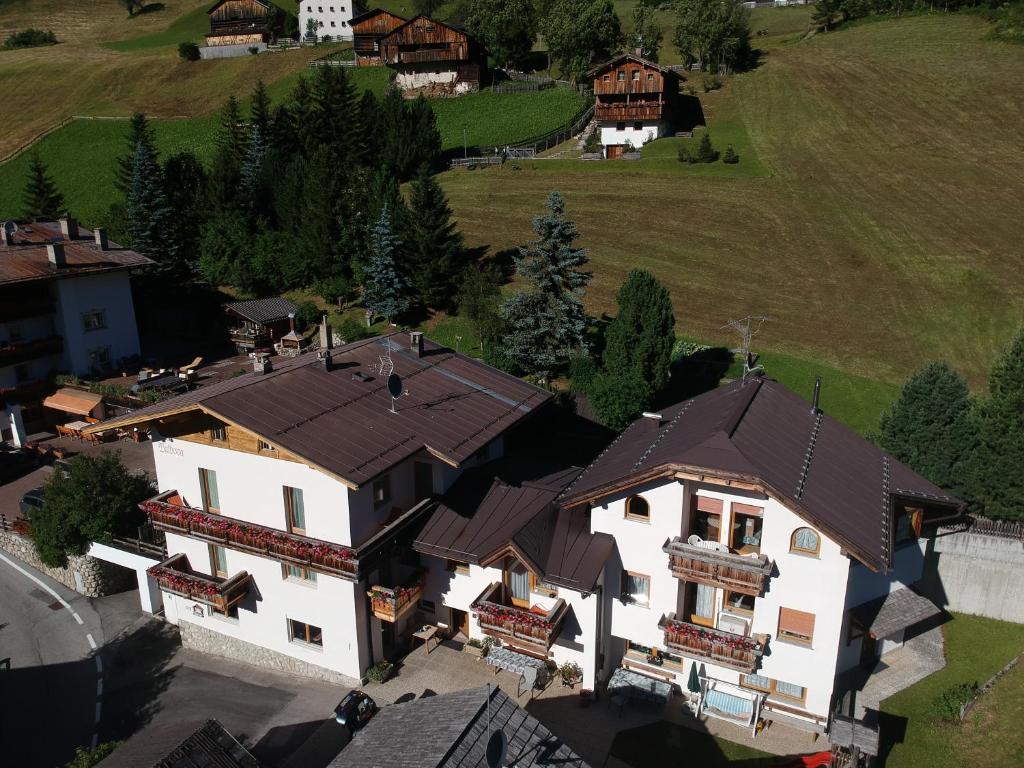 an overhead view of a house with a roof at Pensione Valbona in Corvara in Badia