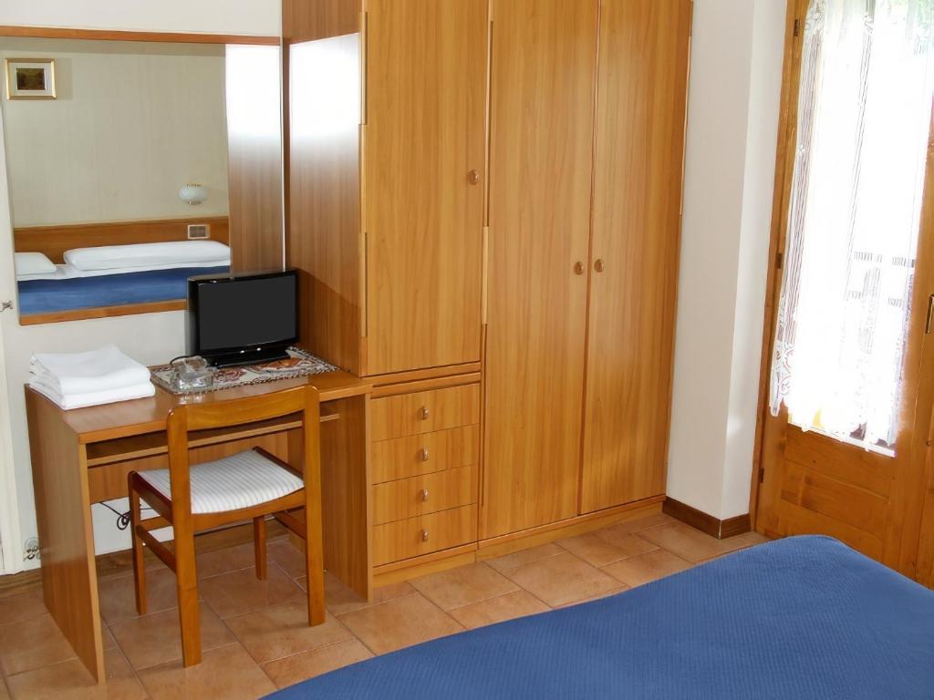 Postel nebo postele na pokoji v ubytování Hotel Ristorante San Pietro
