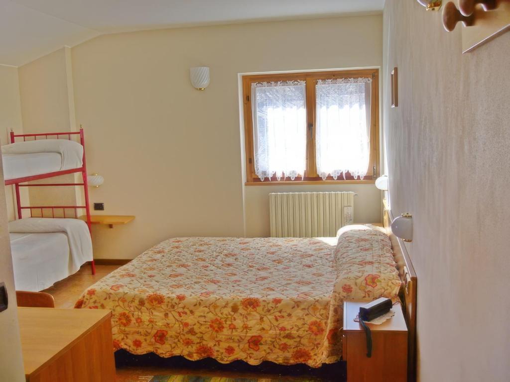 Postel nebo postele na pokoji v ubytování Hotel Ristorante San Pietro