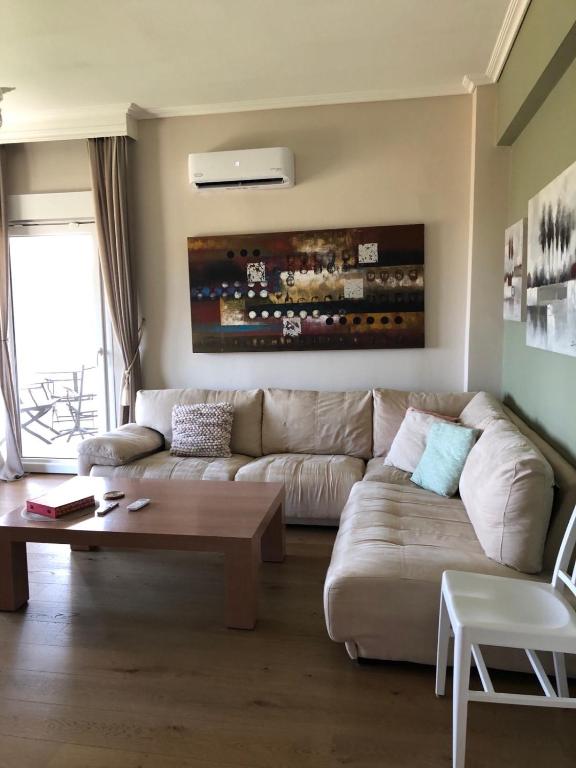 a living room with a couch and a coffee table at Villa Casa Chrissy in Plagiárion