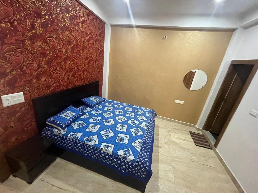 Postel nebo postele na pokoji v ubytování Prabhu Sadan home stay