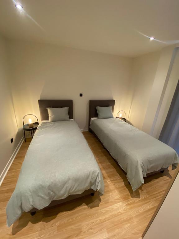 Postel nebo postele na pokoji v ubytování Malpertus