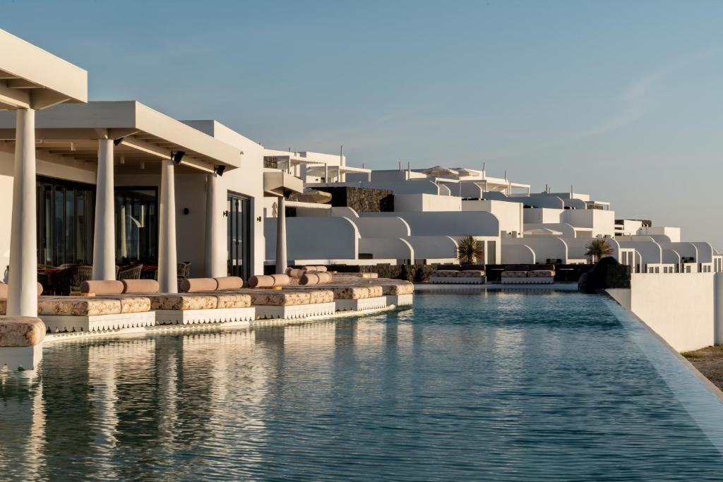 a view of the swimming pool at a resort at Cresanto Luxury Suites in Imerovigli