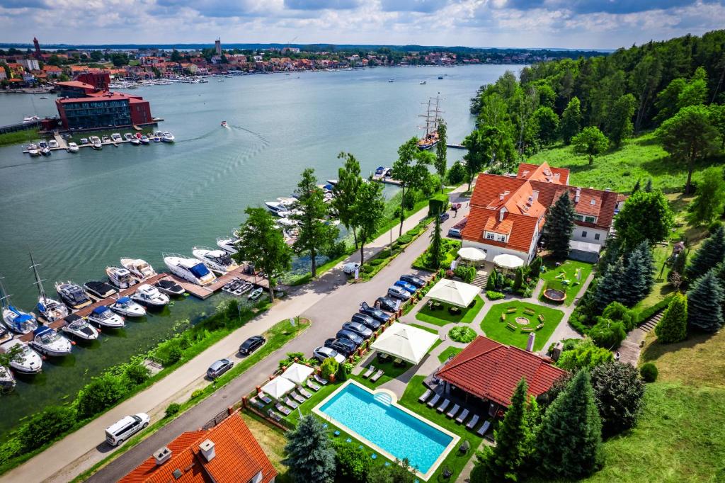 an aerial view of a house next to a river at Amax Boutique Hotel in Mikołajki