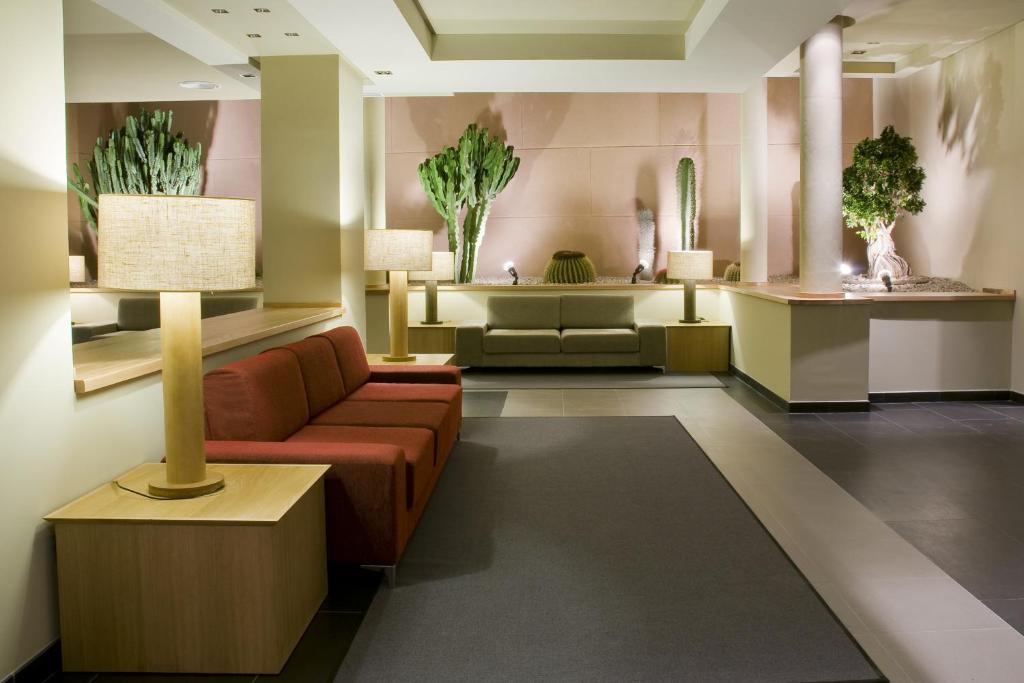 a living room with a couch and a table at Hotel Playa Calera in Valle Gran Rey