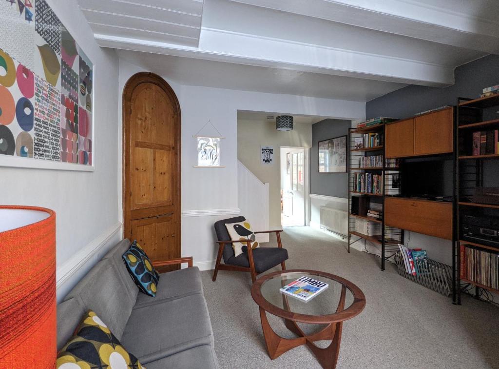 a living room with a couch and a table at Arts House centre of Harwich Harbour in Harwich