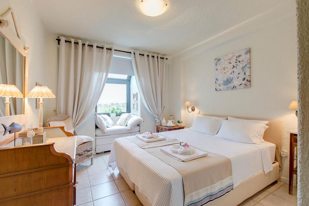 Posteľ alebo postele v izbe v ubytovaní Amelia Villa, Sani Luxury Villas collection