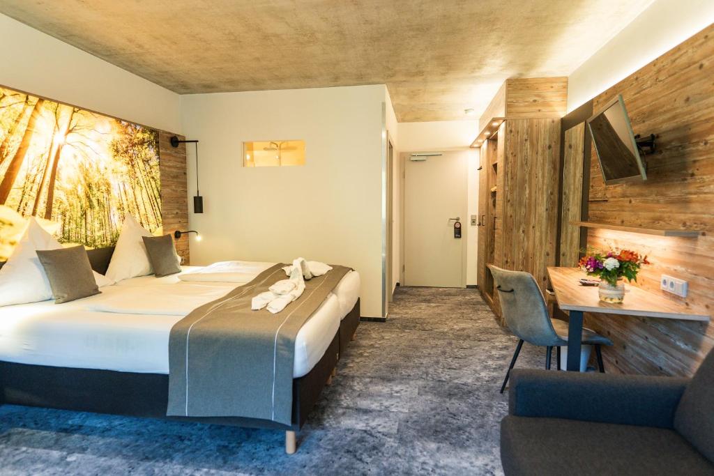 Postel nebo postele na pokoji v ubytování Hotel Christel