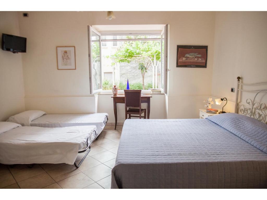 A bed or beds in a room at Casa Vacanze Il Gatto Rosso