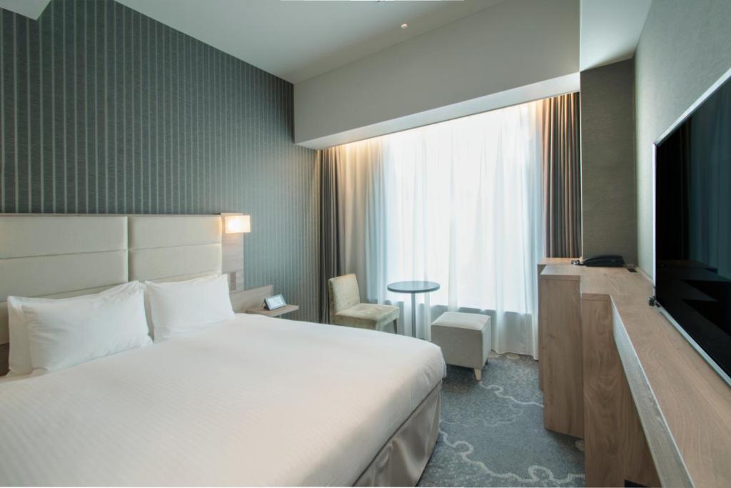 Postel nebo postele na pokoji v ubytování Hotel Keihan Tsukiji Ginza Grande