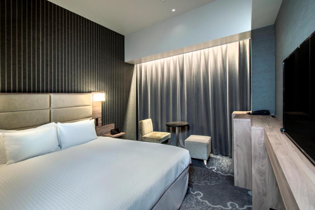 Postel nebo postele na pokoji v ubytování Hotel Keihan Tsukiji Ginza Grande