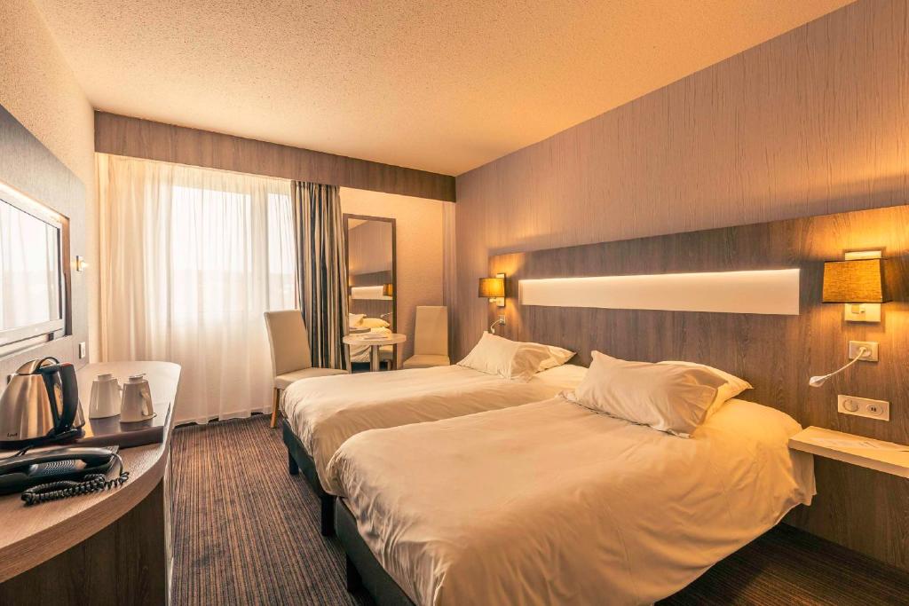 Postel nebo postele na pokoji v ubytování Best Western Marseille Aeroport