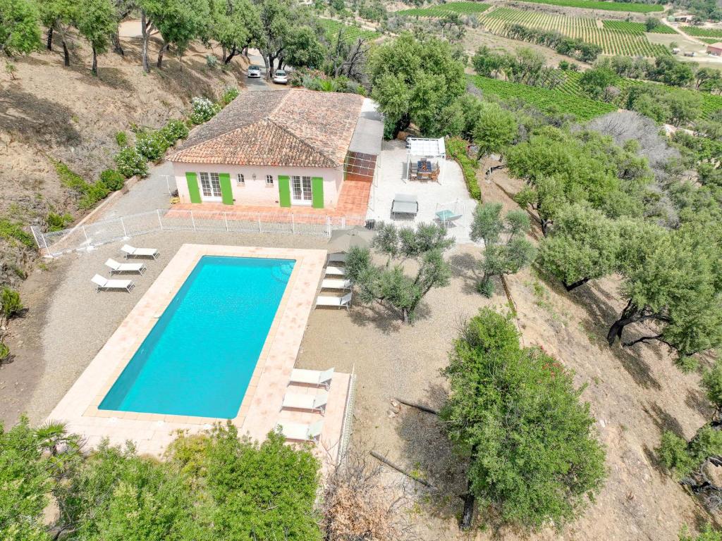an aerial view of a house with a swimming pool at Holiday Home Mas des Chênes - GRI120 by Interhome in Grimaud